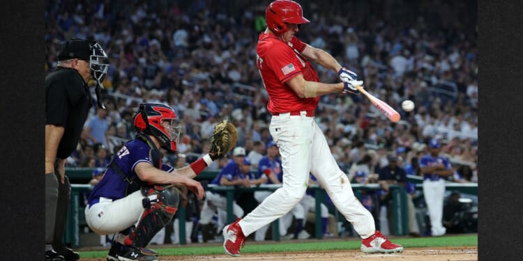 GOP Sen. Eric Schmitt of Missouri connects for a single in the fifth inning during Wednesday's congressional baseball game at Nationals Park in Washington, D.C. The annual game that began in 1901 pits Republican and Democratic congressional members and raises money for charity.