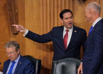Marco Rubio is greeted by U.S. Sen. Rick Scott (R-FL) (R) as he arrives to testify during a Senate Foreign Relations Committee.