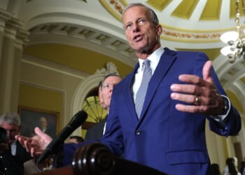 Senate Majority Leader John Thune speaking at a press conference