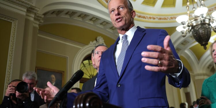 Senate Majority Leader John Thune speaking at a press conference