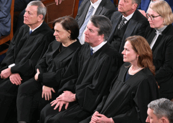 Supreme Court Chief Justice John Roberts, Supreme Court Justice Elena Kagan, Supreme Court Justice Brett Kavanaugh, and Supreme Court Justice Amy Coney Barrett listen as US President Donald Trump delivers the State of the Union address in the House Chamber of the US Capitol in Washington, DC, on February 24, 2026. (Photo by Mandel NGAN / AFP via Getty Images)