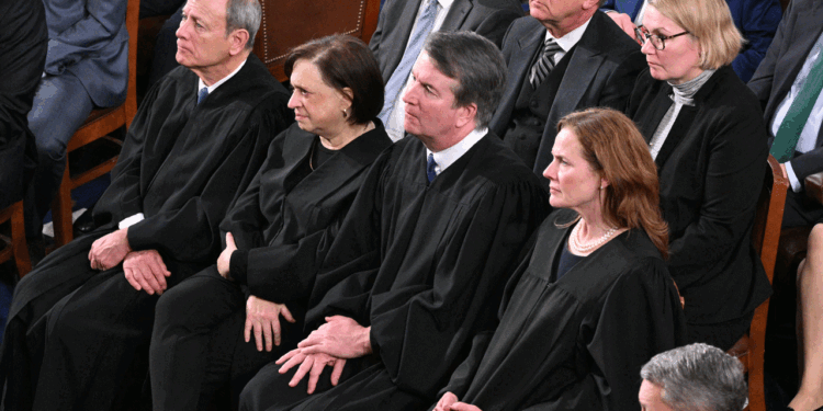 Supreme Court Chief Justice John Roberts, Supreme Court Justice Elena Kagan, Supreme Court Justice Brett Kavanaugh, and Supreme Court Justice Amy Coney Barrett listen as US President Donald Trump delivers the State of the Union address in the House Chamber of the US Capitol in Washington, DC, on February 24, 2026. (Photo by Mandel NGAN / AFP via Getty Images)