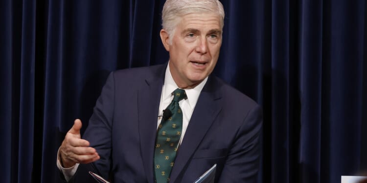 Supreme Court Justice Neil Gorsuch speaking while seated