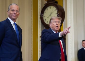 Senate Majority Leader John Thune watches as President Donald Trump speaks to the media as they arrive at the U.S. Capitol on June 24, 2026, in Washington, D.C.