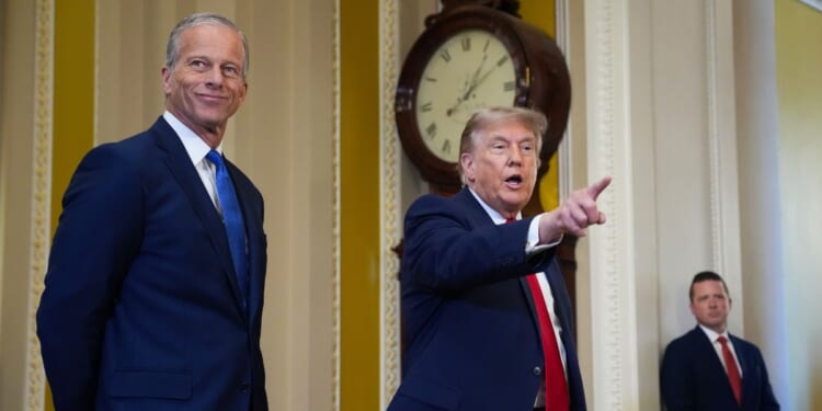 Senate Majority Leader John Thune watches as President Donald Trump speaks to the media as they arrive at the U.S. Capitol on June 24, 2026, in Washington, D.C.