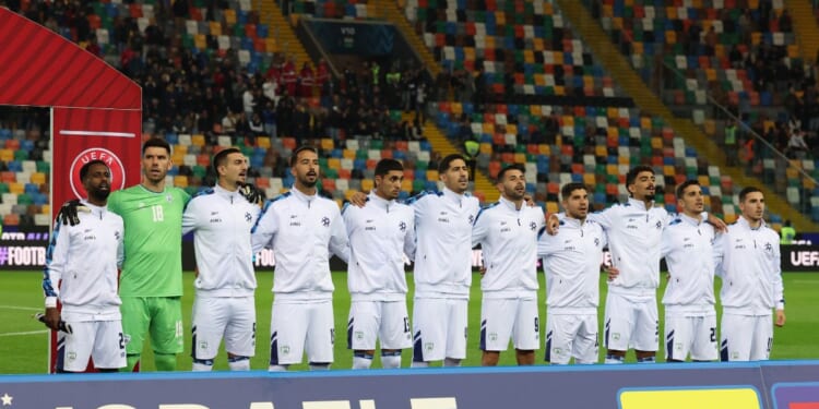 Players from Israel sing the national anthem prior to the FIFA World Cup 2026 qualifier match between Italy and Israel at Stadio Friuli on Oct. 14, 2025, in Udine, Italy.