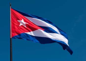 The Cuban flag flies in the wind.