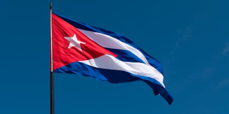 The Cuban flag flies in the wind.