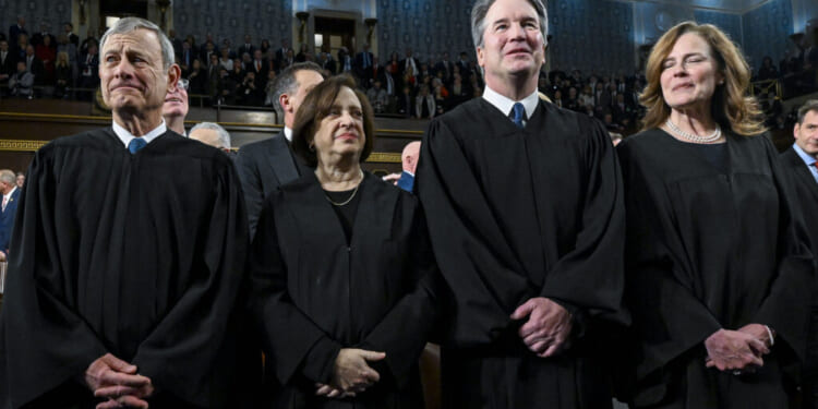 Chief Justice John G. Roberts Jr. and Justices Elena Kagan, Neil Gorsuch and Amy Coney Barrett look on before President Donald Trump's State of the Union address during a joint session of Congress at the Capitol on Fe. 24. (Kenny Holston-Pool/Getty Images)
