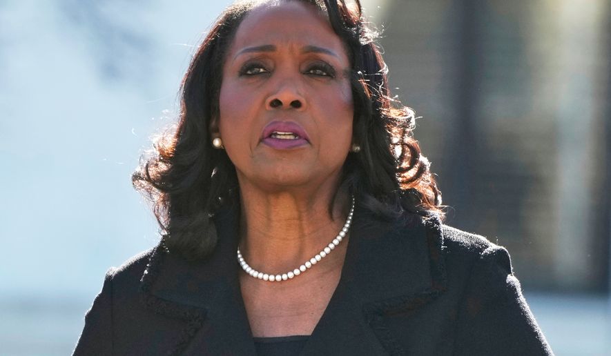 Federal Reserve Board of Governors member Lisa Cook leaves the Supreme Court in Washington on Jan. 21, 2026. (AP Photo/Mark Schiefelbein) **FILE**