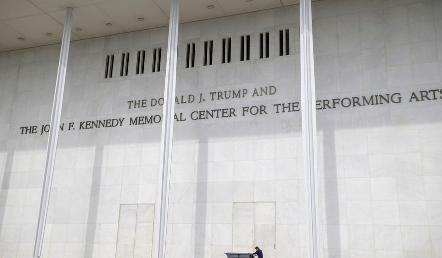 A man wheels a garbage bin outside of The John. F. Kennedy Center for the Performing Arts, Saturday, June 6, 2026, in Washington. (AP Photo/Rod Lamkey, Jr.)