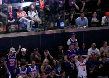President Donald Trump sits next to Knicks owner James Dolan Monday as they attend Game Three of the NBA Finals between the San Antonio Spurs and the New York Knicks at Madison Square Garden in New York City.