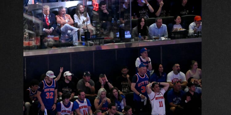 President Donald Trump sits next to Knicks owner James Dolan Monday as they attend Game Three of the NBA Finals between the San Antonio Spurs and the New York Knicks at Madison Square Garden in New York City.