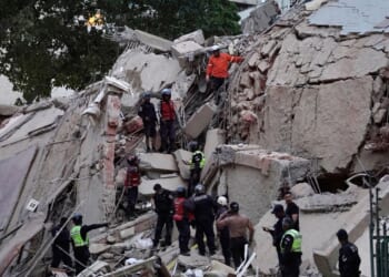 Rescuers search for victims in a collapsed building following an earthquake in Caracas, Venezuela, on June 24, 2026.