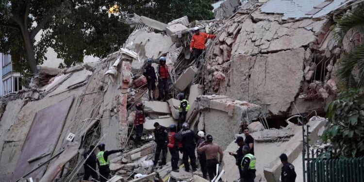 Rescuers search for victims in a collapsed building following an earthquake in Caracas, Venezuela, on June 24, 2026.