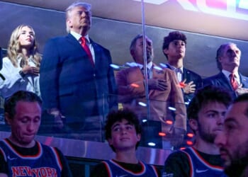 President Donald Trump with his granddaughter Kai Trump, left, Knicks owner James Dolan, Secretary of the Interior Doug Burgum, and Environmental Protection Agency director Lee Zeldin attend Game Three of the NBA Finals between the San Antonio Spurs and the New York Knicks at Madison Square Garden Monday in New York City.