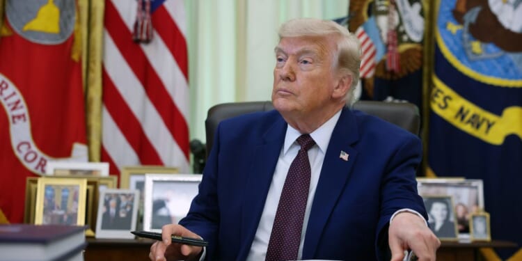 President Donald Trump prepares to sign an executive order during an event in the Oval Office of the White House on June 3, 2026, in Washington, D.C.