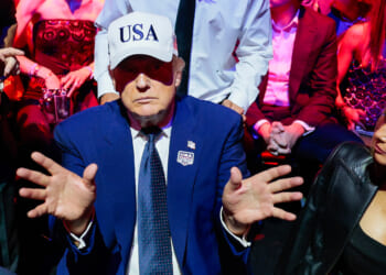 Donald Trump gestures to Melania Trump.