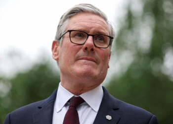 Close-up of UK Prime Minister Keir Starmer with pursed lips.