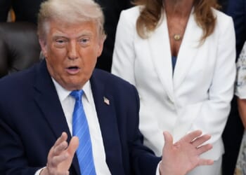 President Donald Trump addresses reporters in the Oval Office on Wednesday.