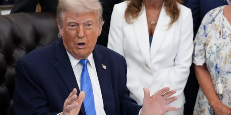President Donald Trump addresses reporters in the Oval Office on Wednesday.