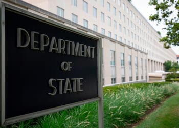 The Department of State sign stands outside the State Department Building in Washington, D.C. on July 22, 2019.