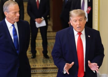 GOP Senate Majority Leader John Thune of South Daokota, left, watches as President Donald Trump speaks to the media Wednesday as they arrive at the U.S. Capitol in Washington, D.C.