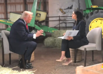 President Donald Trump face-to-face with NBC's Kristen Welker during interview, green tractor in the background