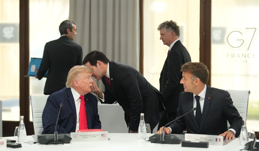U.S. Secretary of State Marco Rubio, center, speaks with U.S. President Donald Trump, left, during a working session at the G7 summit in Evian-les-Bains, France, Tuesday, June 16, 2026. (AP Photo/Thibault Camus, Pool)