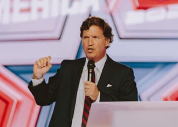 Conservative political commentator and podcast host Tucker Carlson speaks at Turning Point's annual AmericaFest conference, in remembrance of late right-wing political activist Charlie Kirk, in Phoenix, Arizona, on Dec. 18, 2025.