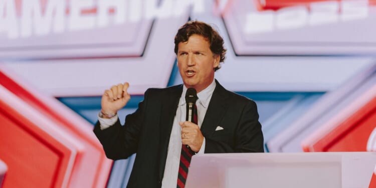 Conservative political commentator and podcast host Tucker Carlson speaks at Turning Point's annual AmericaFest conference, in remembrance of late right-wing political activist Charlie Kirk, in Phoenix, Arizona, on Dec. 18, 2025.