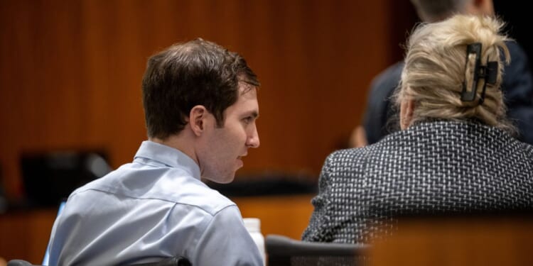 Tyler Robinson speaks with his defense attorney Kathryn Nester during a hearing for Tyler Robinson, accused in the fatal shooting of Charlie Kirk, in 4th District Court on Friday, April 17, 2026, in Provo, Utah.