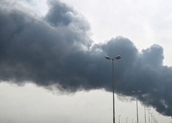 Smoke rises from near the Kuwait International Airport after a reported drone strike on March 25, 2026.