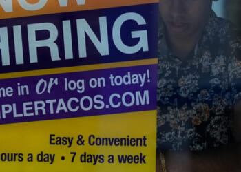 A hiring sign is displayed at a restaurant in Niles, Illinois, on May 14, 2026.