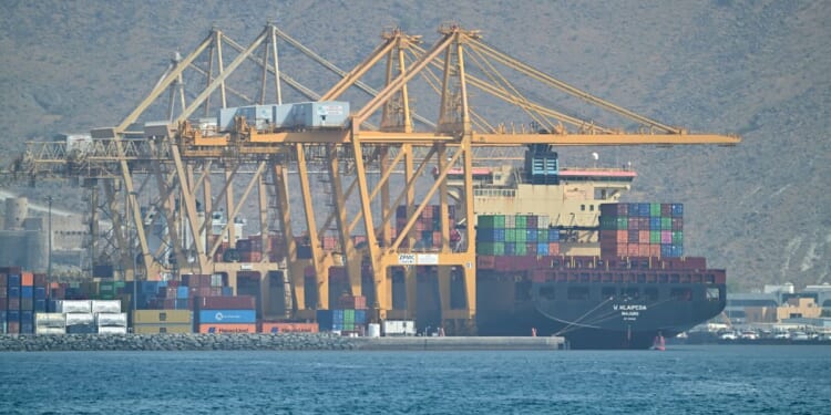 The Marshall Island flagged container vessel K Klaipeda is seen docked along a pier at the Khor Fakkan Container Terminal, the only natural deep-sea port in the region and one of the major container ports in Sharjah Emirate, along the Gulf of Oman on Sunday.