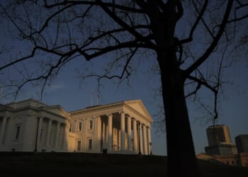 The Virginia State Capitol stands at sunset.
