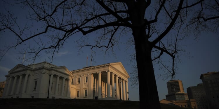 The Virginia State Capitol stands at sunset.