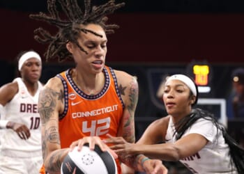 Brittney Griner of the Connecticut Sun drives against Angel Reese of the Atlanta Dream during the first quarter at Gateway Center Arena on June 2, 2026, in College Park, Georgia.
