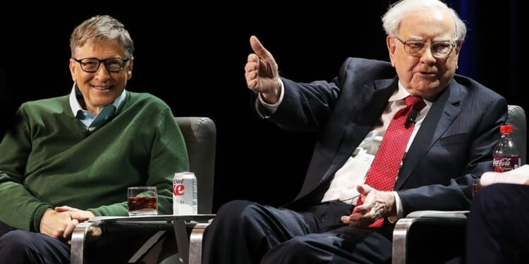 Billionaire Warren Buffett, right, pictured with Bill Gates in a 2017 photo, has delayed his annual gift to the Gates Foundation pending a report on whether the organization had links to Jeffrey Epstein and, if so, how extensive they were.