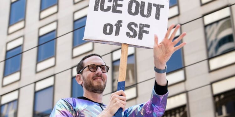 Sen. Scott Weiner waves to onlookers on June 29, 2025, during the "gay pride" parade in San Francisco, California.