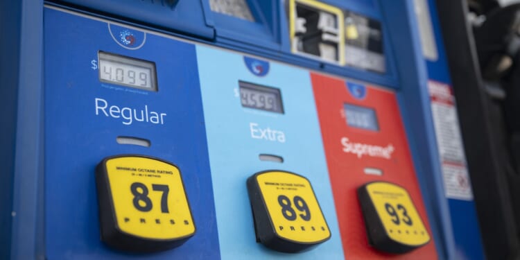 Gas prices exceeding $4 dollars per gallon are displayed