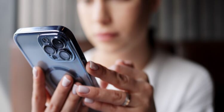 A woman uses her smartphone.