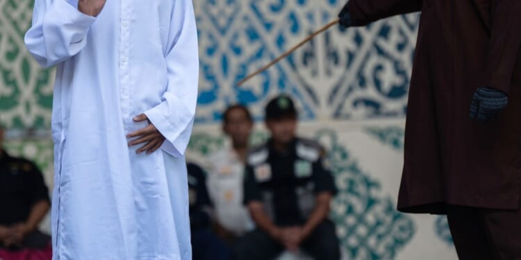 Couple caned by Indonesian province for violating Sharia law by kissing on TikTok