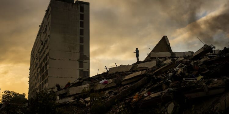 Fallout from Venezuela’s earthquakes turns political as opposition leader Machado seeks return