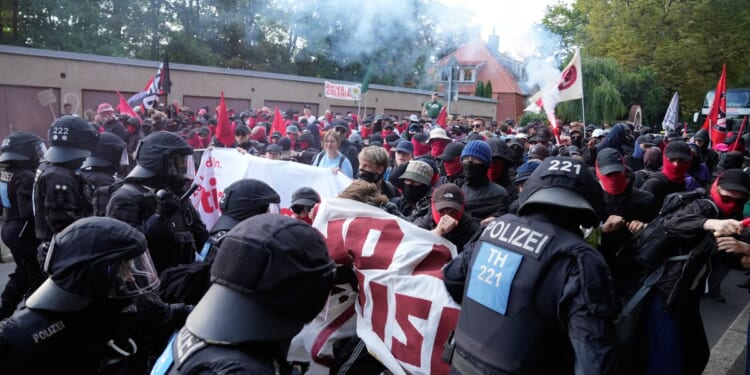 Far-right Alternative for Germany party reelects leaders as protesters and police clash