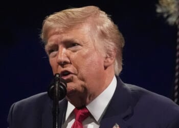 Trump posts doctored photo of Obamas and Air Force One with graffiti spray-painted on plane