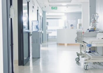 A hospital with an empty corridor.