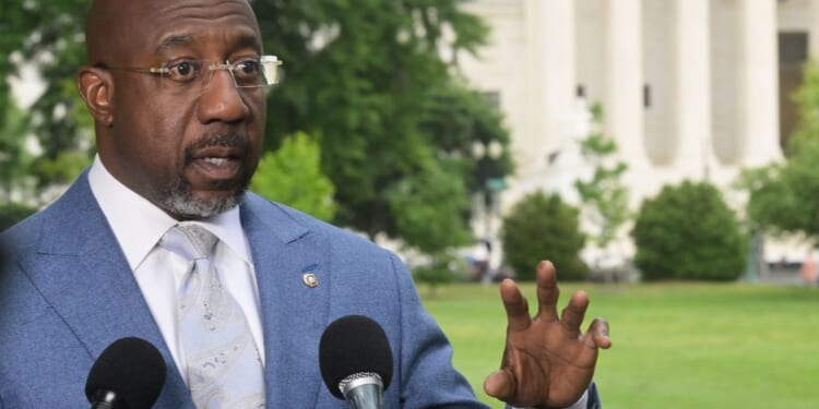 Raphael Warnock suggests God sent July 4 storm to rebuke Trump rally