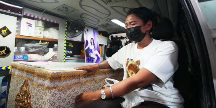 The band playing when a Bangkok bar caught fire mourns its members among the 32 dead