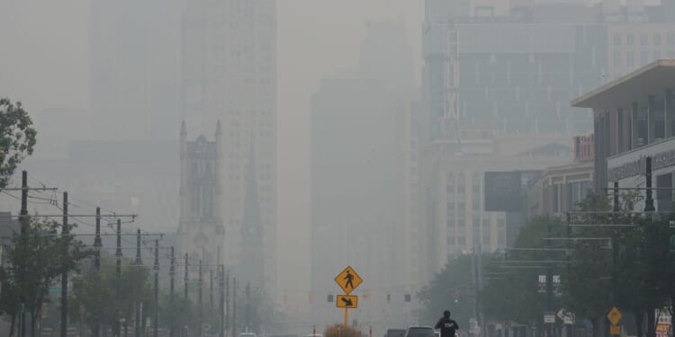 Wildfire smoke makes air unhealthy from the U.S. Midwest to East Coast. Officials say stay inside